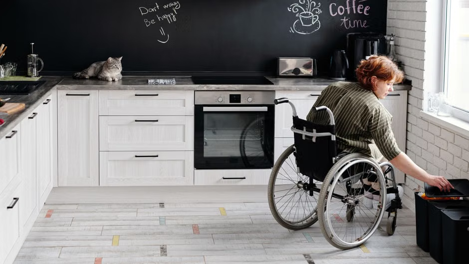 Close-up view of wheelchair wheels and seat width frame